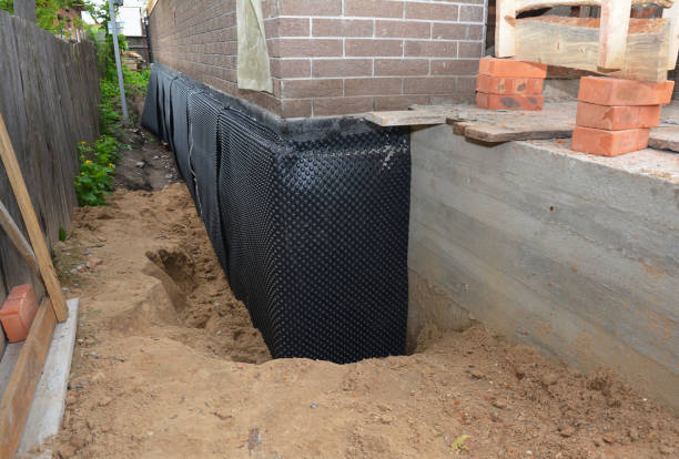 Happy homeowners after waterproofing job in Heislerville